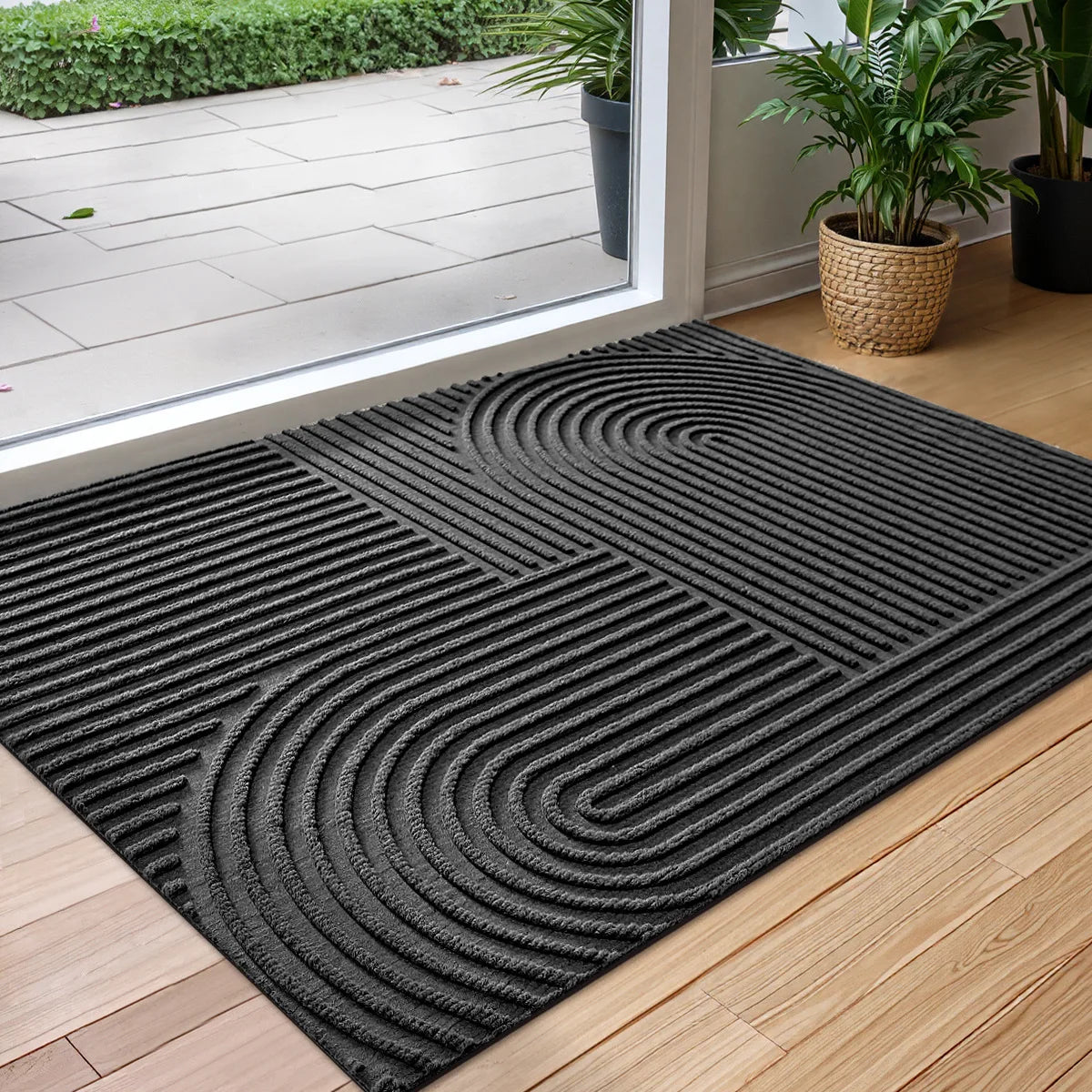 Rectangular geometric door mat with raised grooves by a glass entrance door