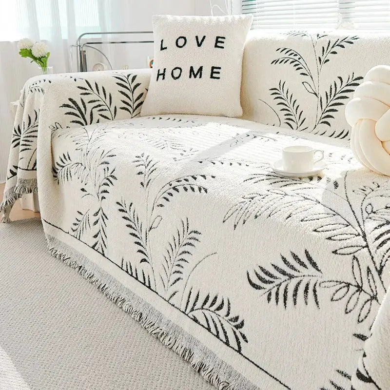 Chenille jacquard sofa cover with botanical leaf pattern and fringed edge
