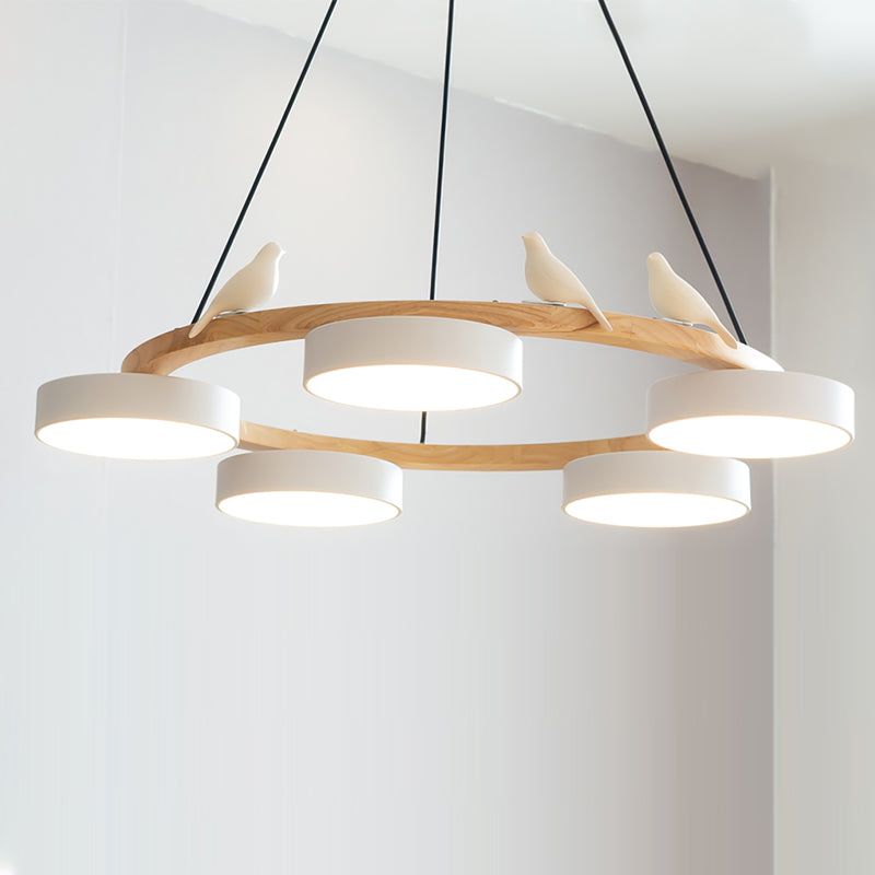 Round chandelier with four pendant shades, a wood-effect ring and bird ornament