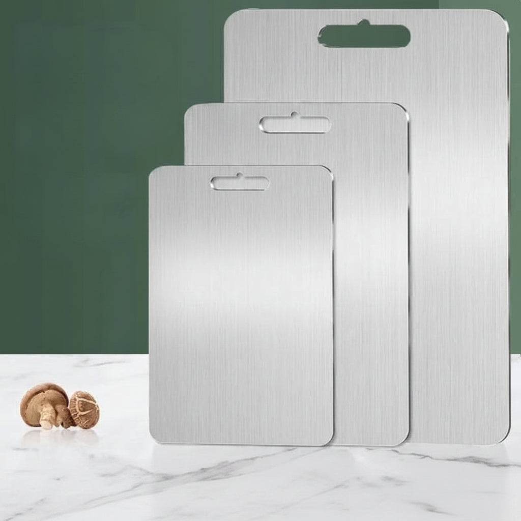 Rectangular silver chopping board with rounded corners and handle opening