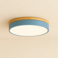 Circular LED ceiling light with a wood-effect rim and smooth light panel