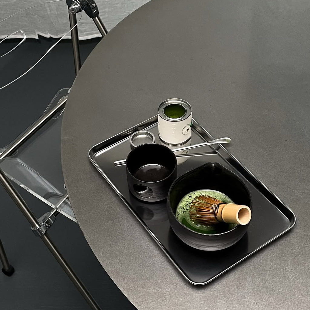 Reflective silver stainless steel serving tray with raised edge