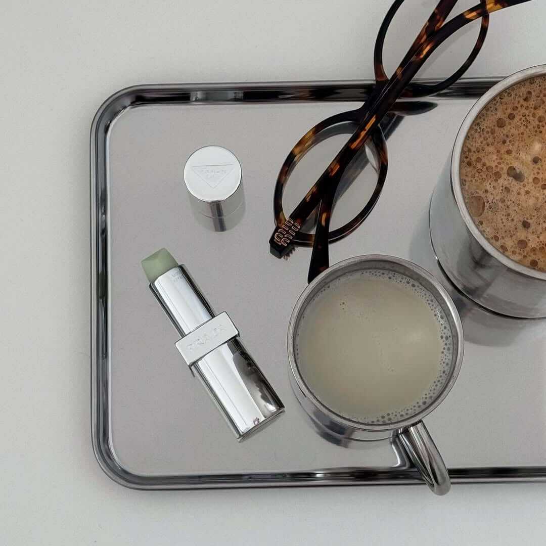 Reflective silver stainless steel serving tray with raised edge
