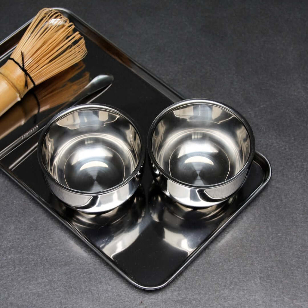 Reflective silver stainless steel serving tray with raised edge