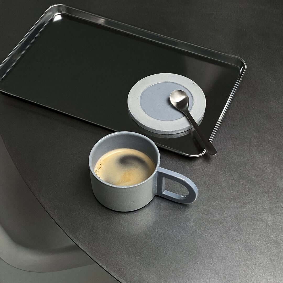 Reflective silver stainless steel serving tray with raised edge