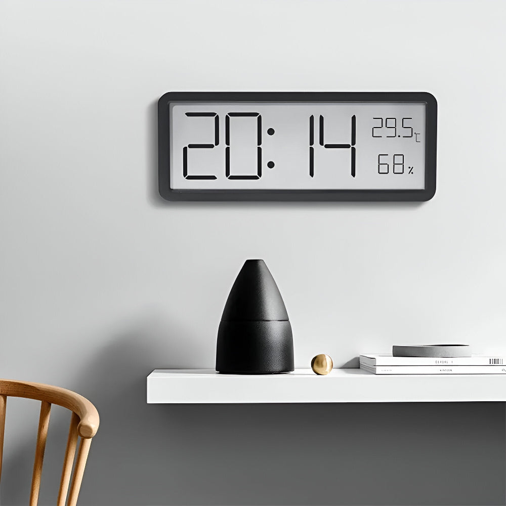 Digital wall clock displaying time, temperature and humidity