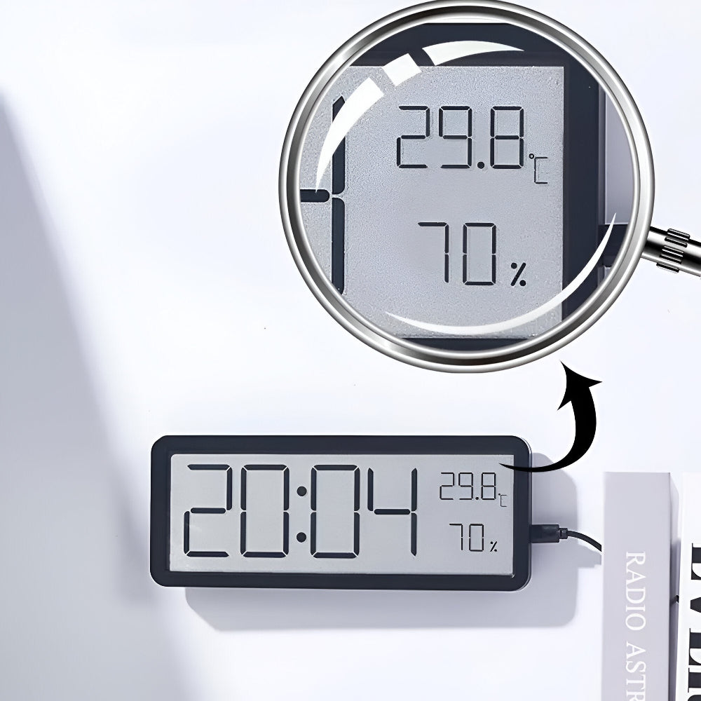 Digital wall clock displaying time, temperature and humidity