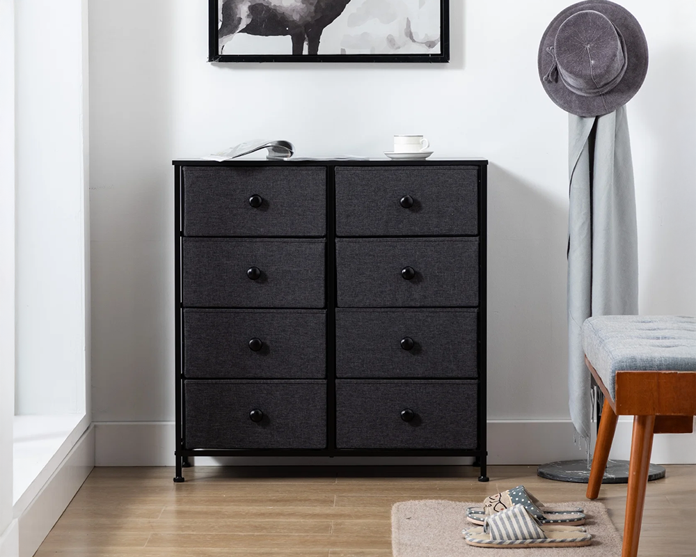 Black tall chest of drawers with eight dark fabric-effect drawer fronts