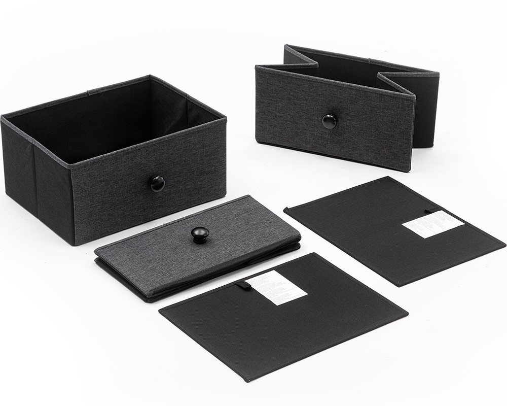 Black tall chest of drawers with eight dark fabric-effect drawer fronts