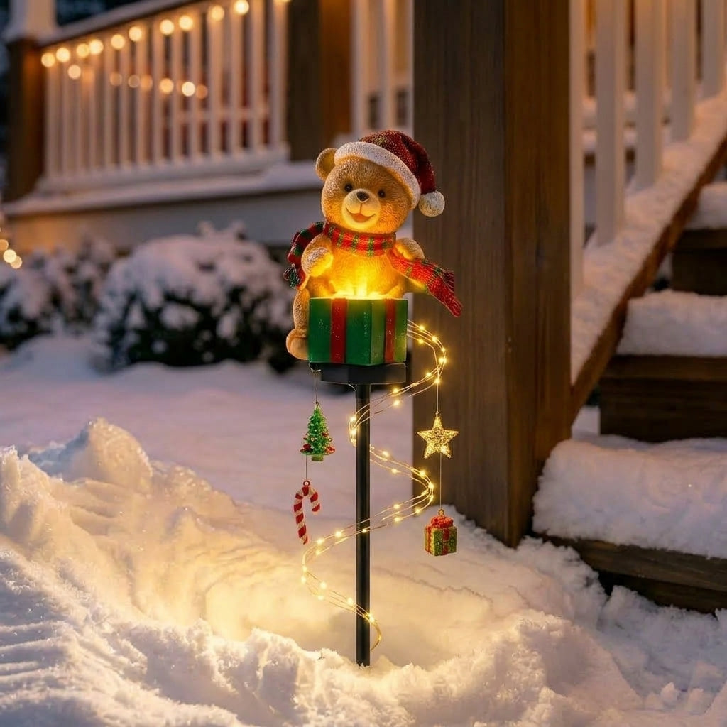 Christmas garden stake decoration with warm white lights and festive reindeer or angel design