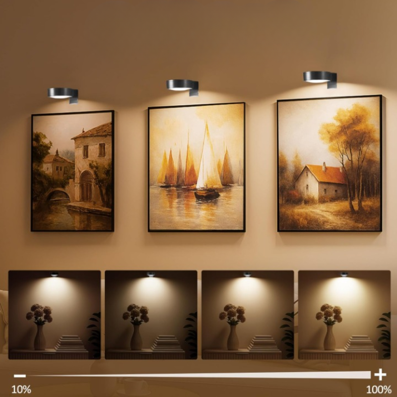 Wireless wall-mounted picture light above framed artwork with remote control