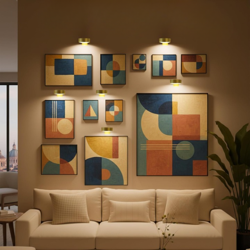 Wireless wall-mounted picture light above framed artwork with remote control