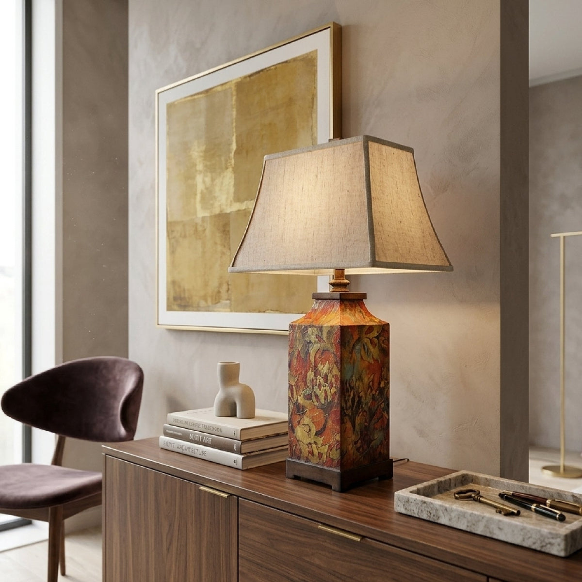 Floral table lamp with beige tapered shade and colourful patterned base