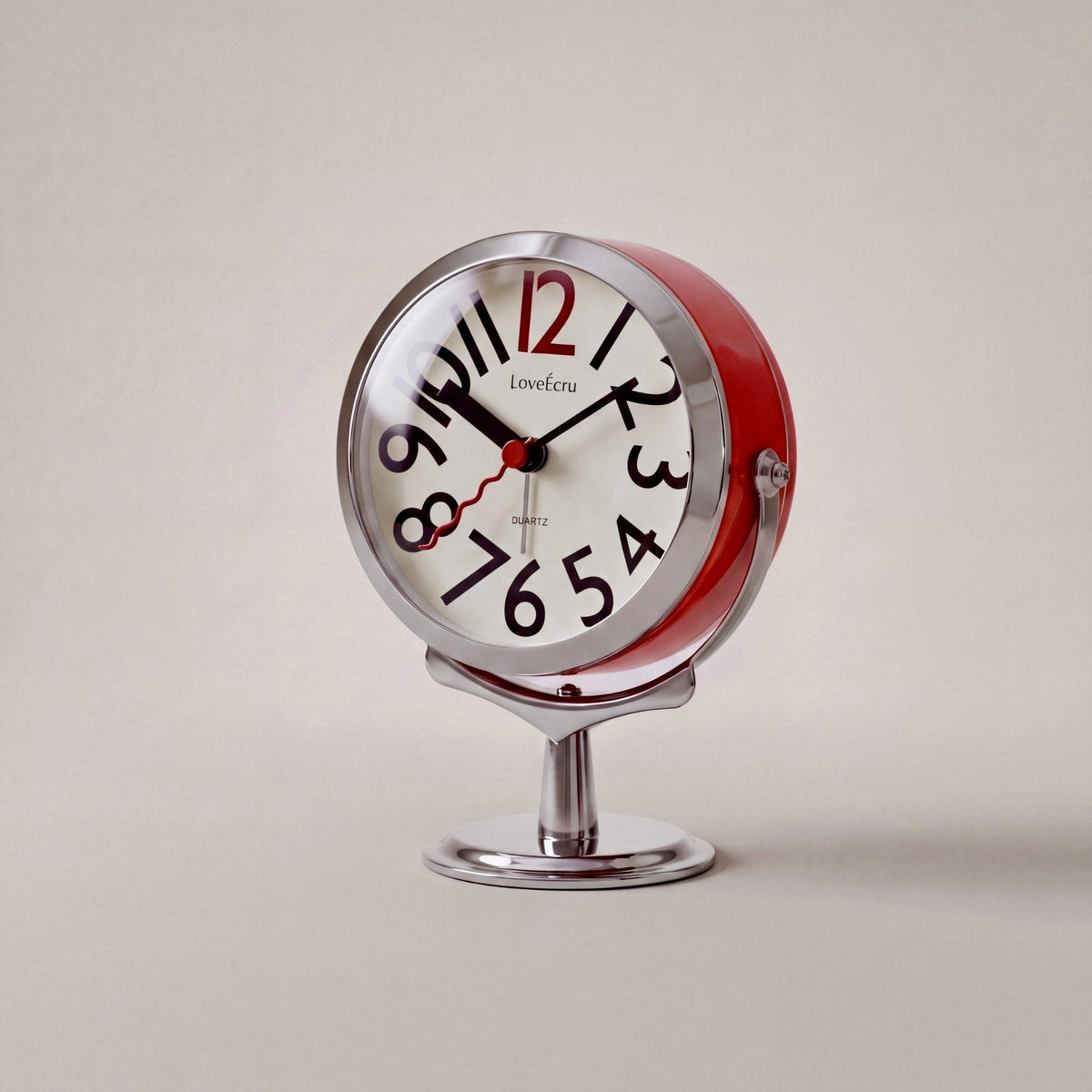 Freestanding analogue alarm clock with bold numbered dial and chrome effect stand