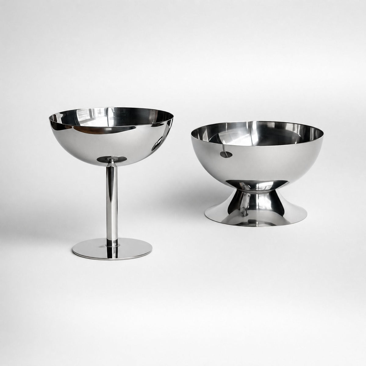 Silver stainless steel ice cream cup with a rounded bowl and pedestal base