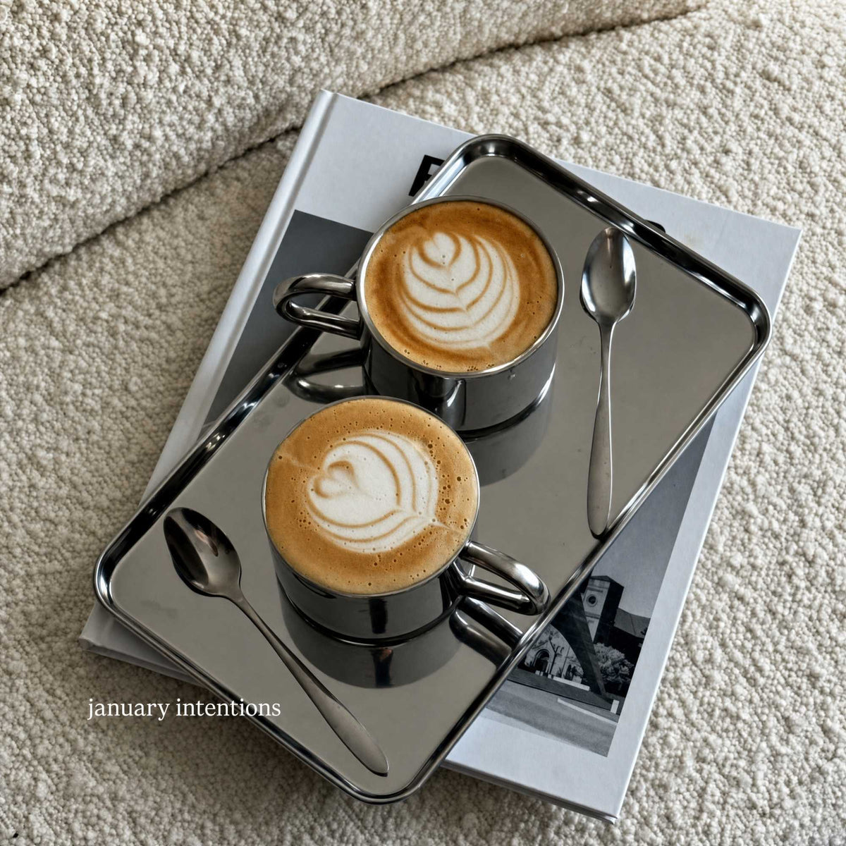 Reflective silver stainless steel serving tray with raised edge