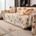 Floral sofa cover with botanical flowers, leaves and fringed edges