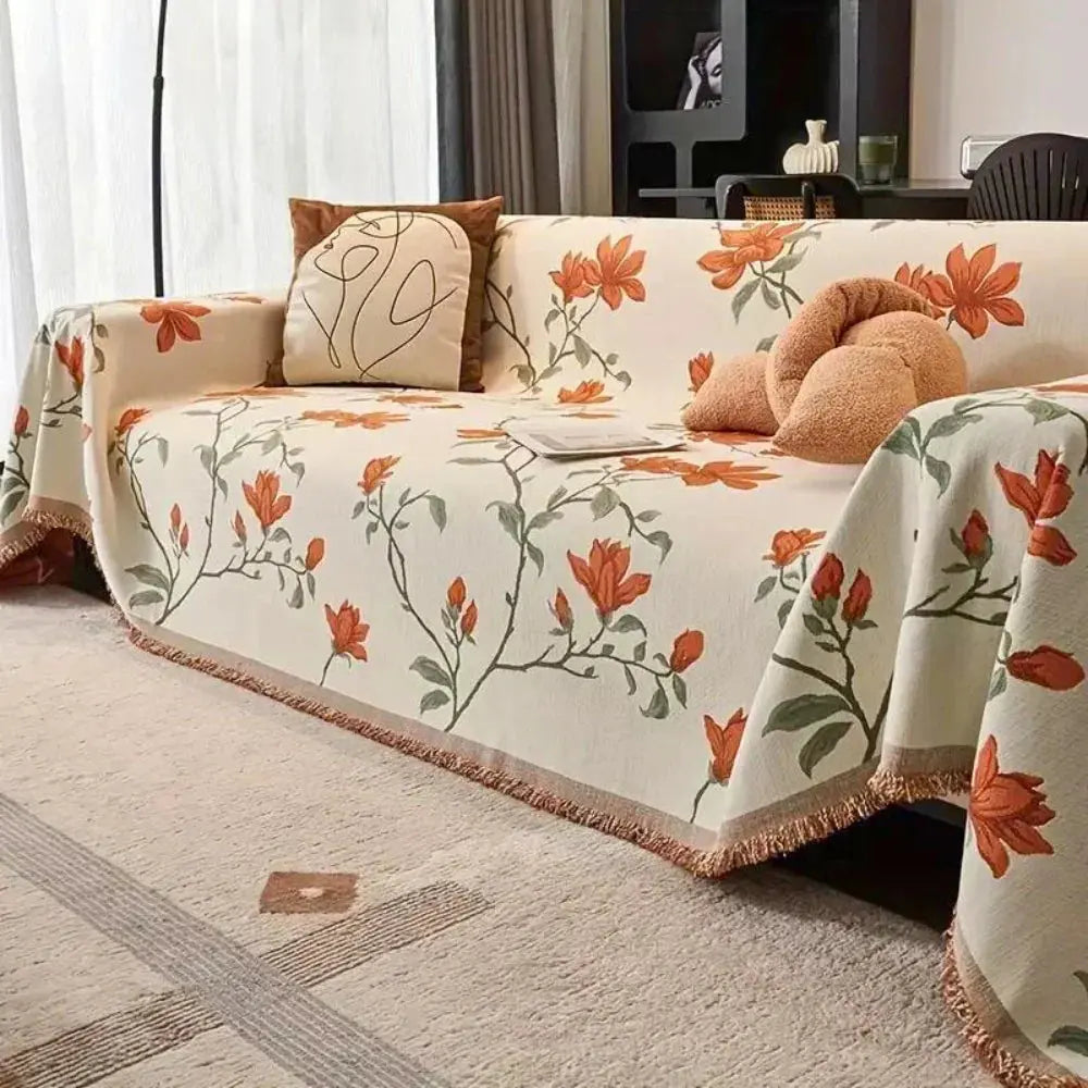 Floral sofa cover with botanical flowers, leaves and fringed edges
