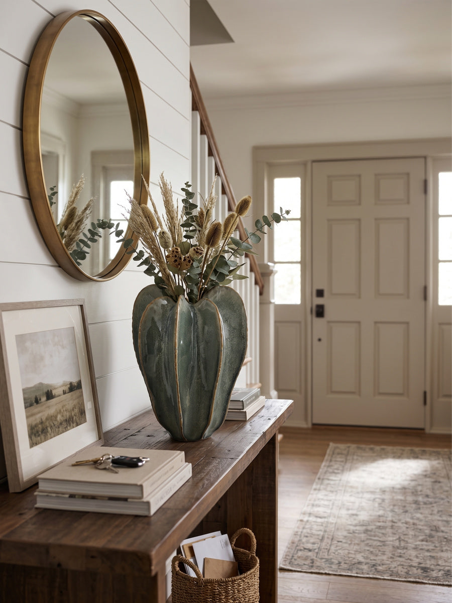 Sage green ribbed ceramic flower vase with a sculptural shape