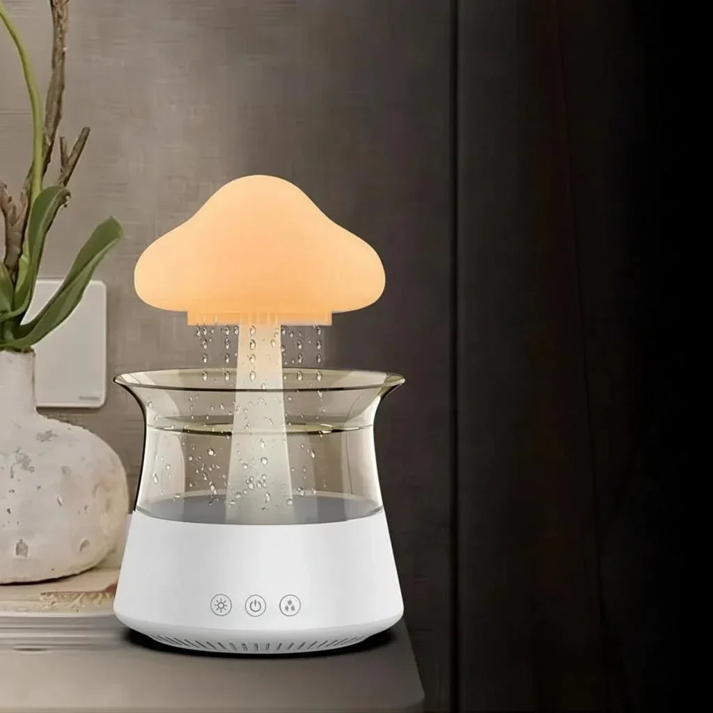 Cloud-shaped humidifier with transparent reservoir and decorative mist effect