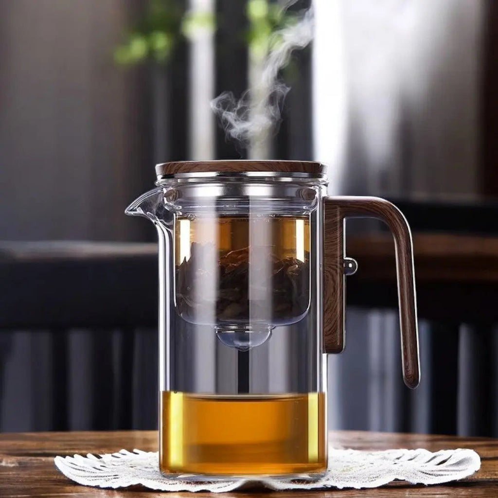 Clear glass tea infuser teapot with brown wood-effect handle and lid