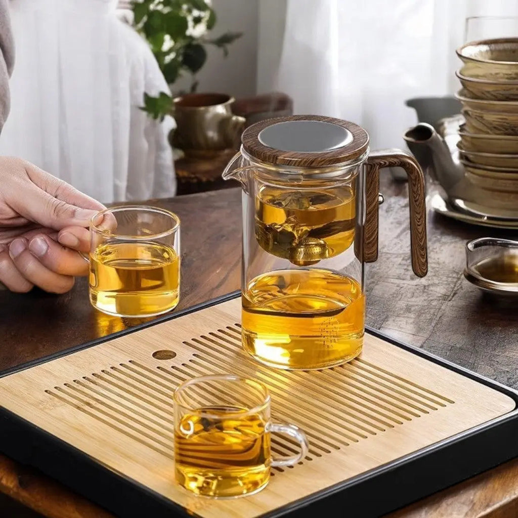 Clear glass tea infuser teapot with brown wood-effect handle and lid