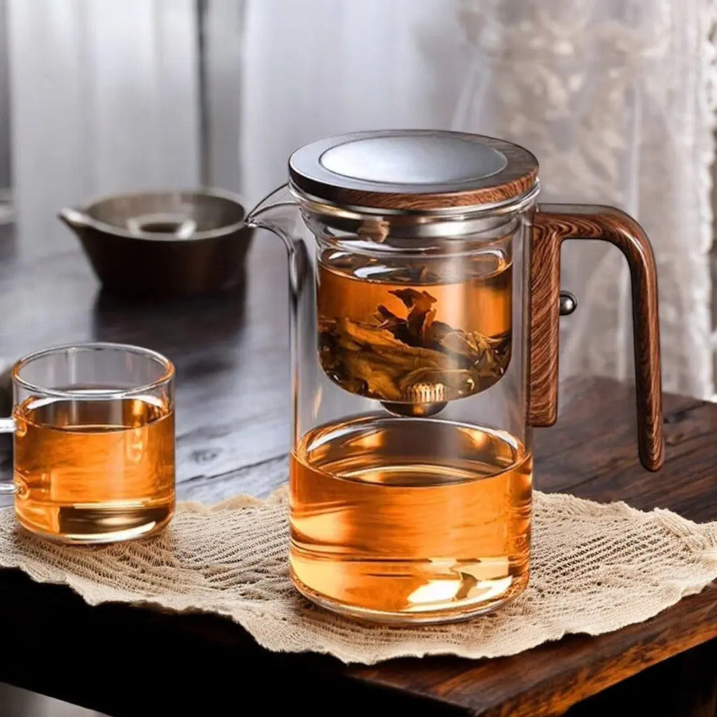 Clear glass tea infuser teapot with brown wood-effect handle and lid