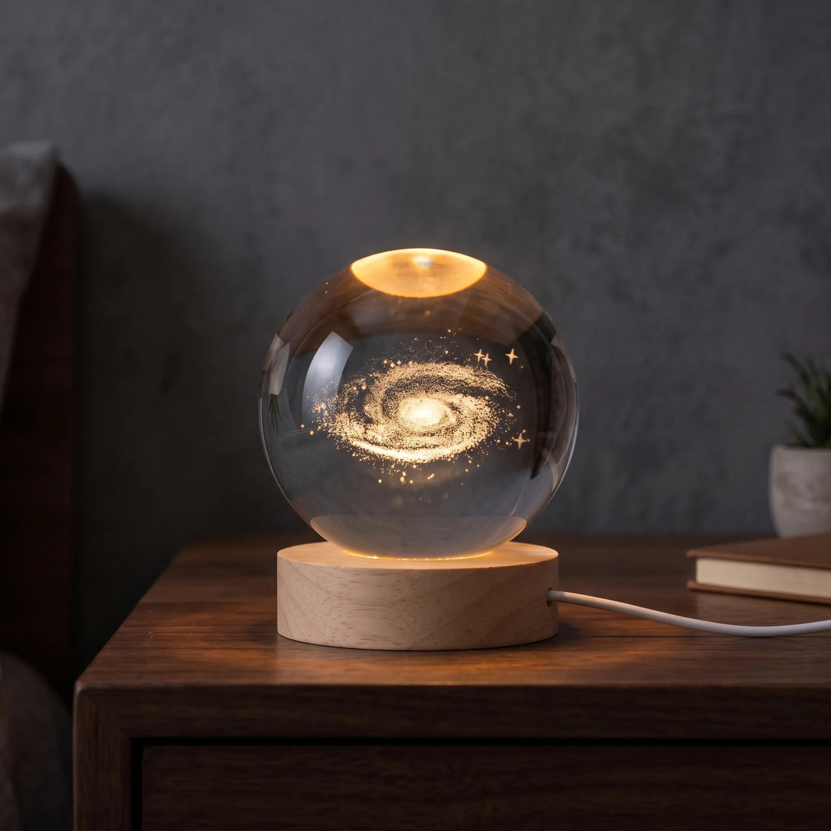 Zophiro - Engraved Celestial Sphere Night Light Illuminating A Bedside Table At Night