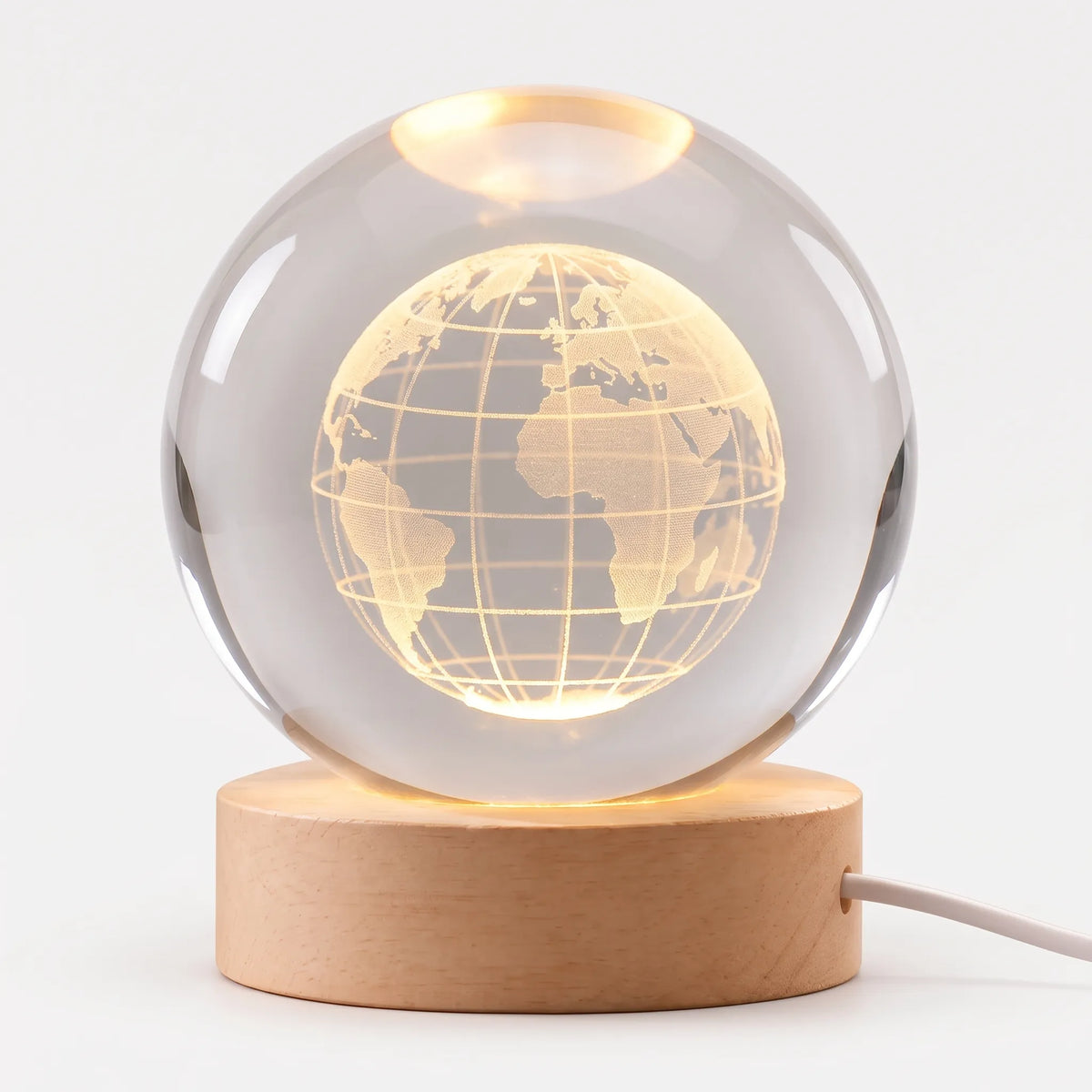 Zophiro - Engraved Celestial Sphere Night Light Illuminating A Bedside Table At Night