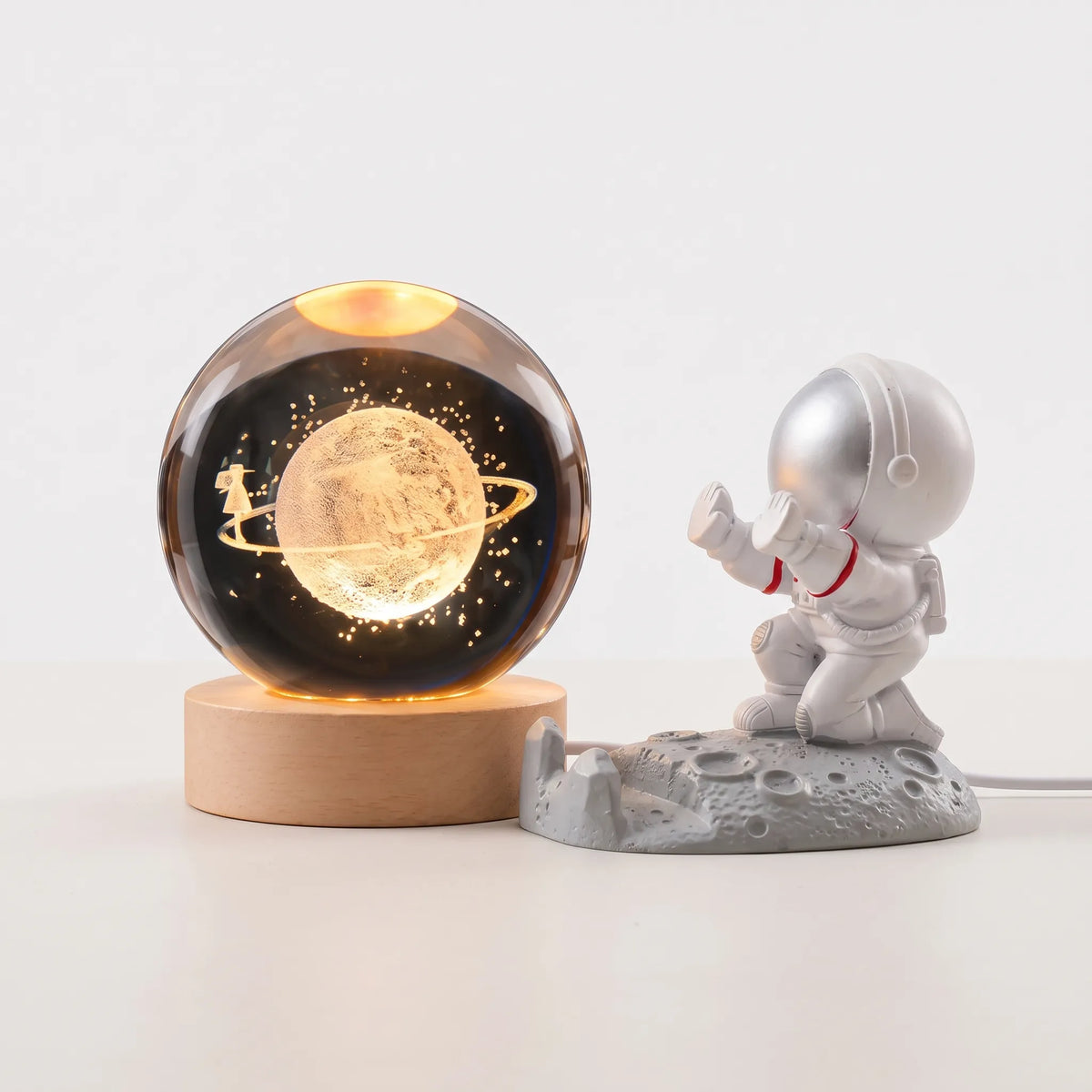 Zophiro - Engraved Celestial Sphere Night Light Illuminating A Bedside Table At Night