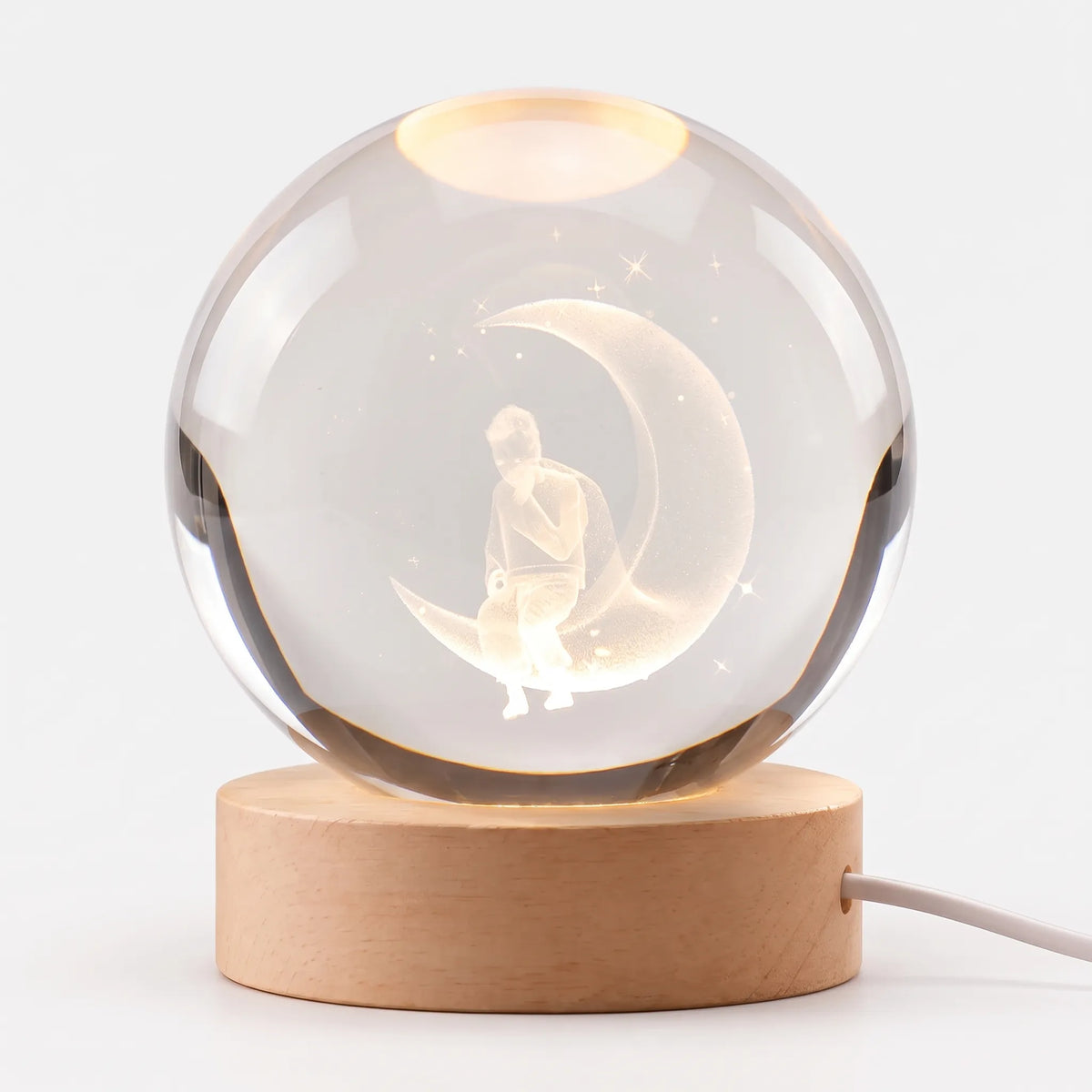 Zophiro - Engraved Celestial Sphere Night Light Illuminating A Bedside Table At Night