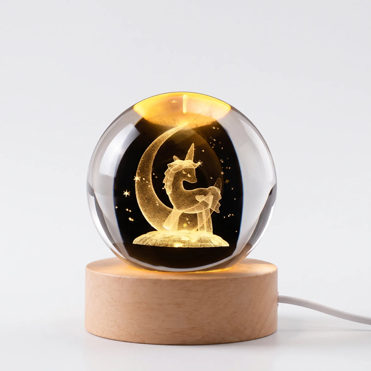 Zophiro - Engraved Celestial Sphere Night Light Illuminating A Bedside Table At Night