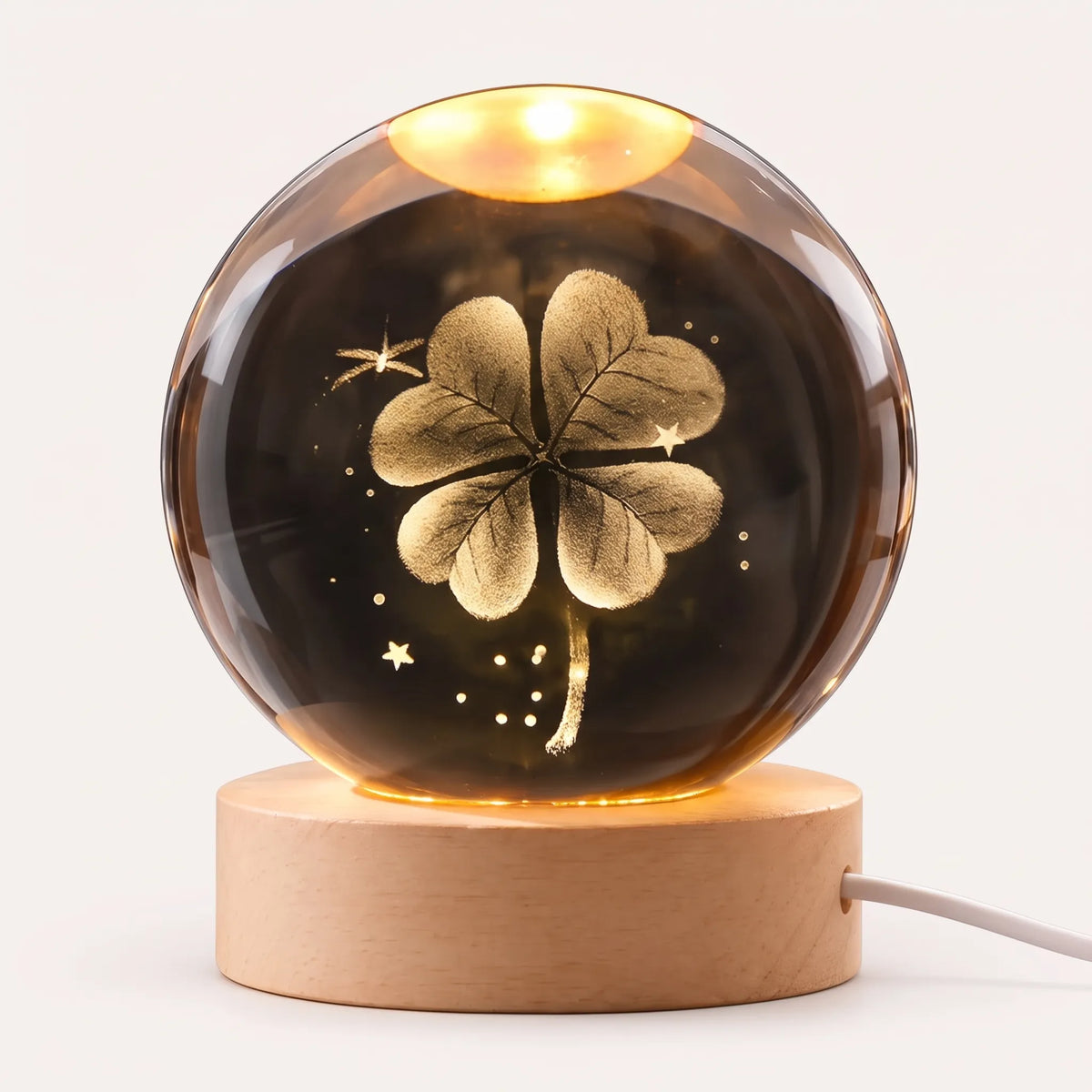 Zophiro - Engraved Celestial Sphere Night Light Illuminating A Bedside Table At Night