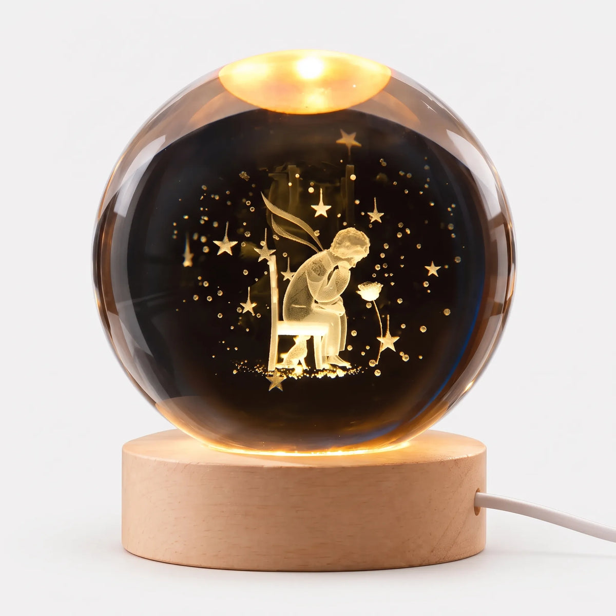Zophiro - Engraved Celestial Sphere Night Light Illuminating A Bedside Table At Night