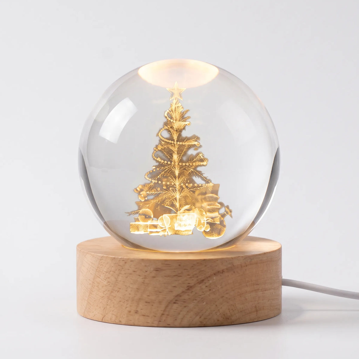 Zophiro - Engraved Celestial Sphere Night Light Illuminating A Bedside Table At Night
