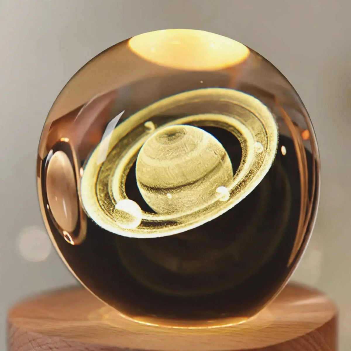 Zophiro - Engraved Celestial Sphere Night Light Illuminating A Bedside Table At Night