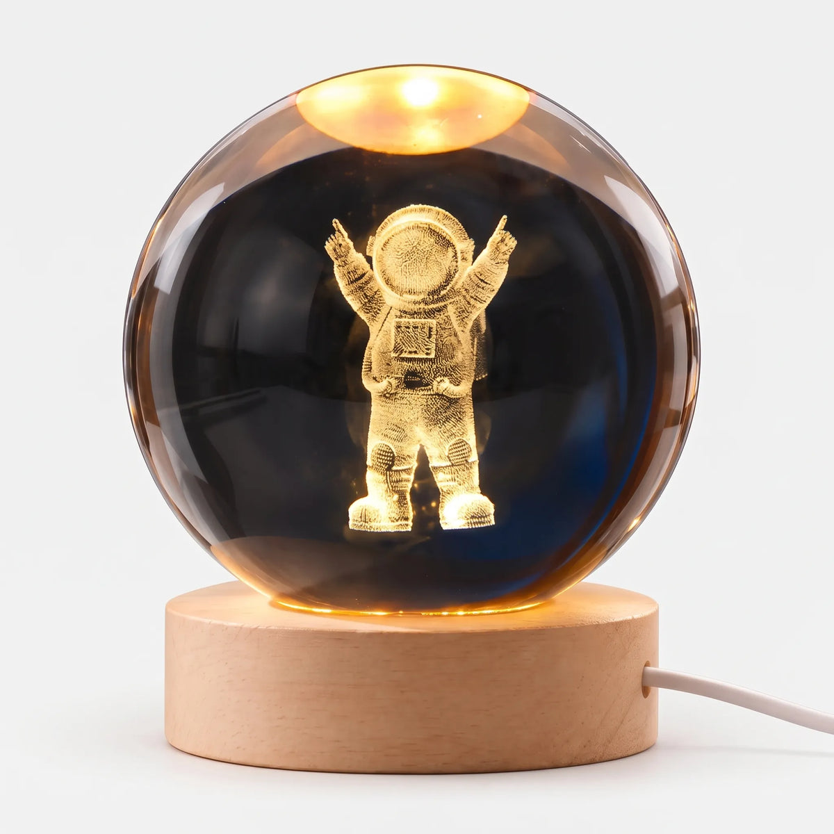 Zophiro - Engraved Celestial Sphere Night Light Illuminating A Bedside Table At Night