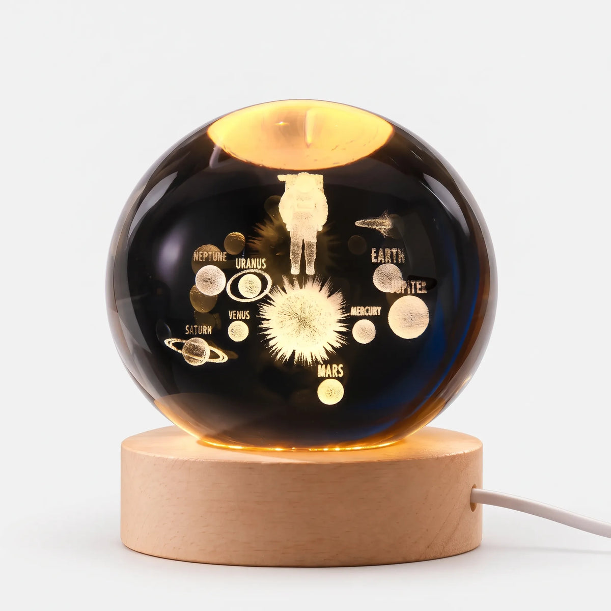 Zophiro - Engraved Celestial Sphere Night Light Illuminating A Bedside Table At Night