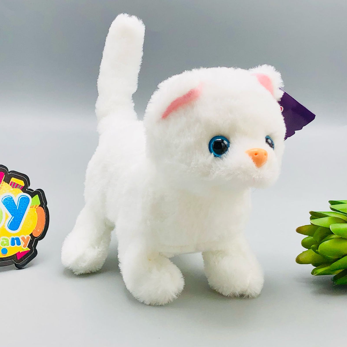 Walking plush cat toy with sound in white and orange colourways