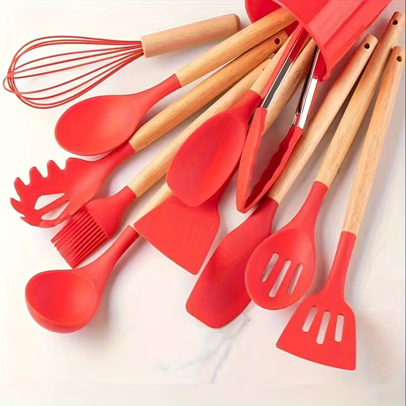 Silicone kitchen utensil set with wood-effect handles in a storage holder