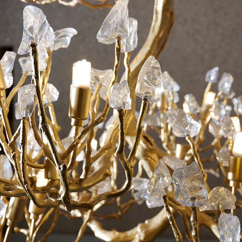 Tree branch pendant light with layered translucent leaf-style details and hanging chain