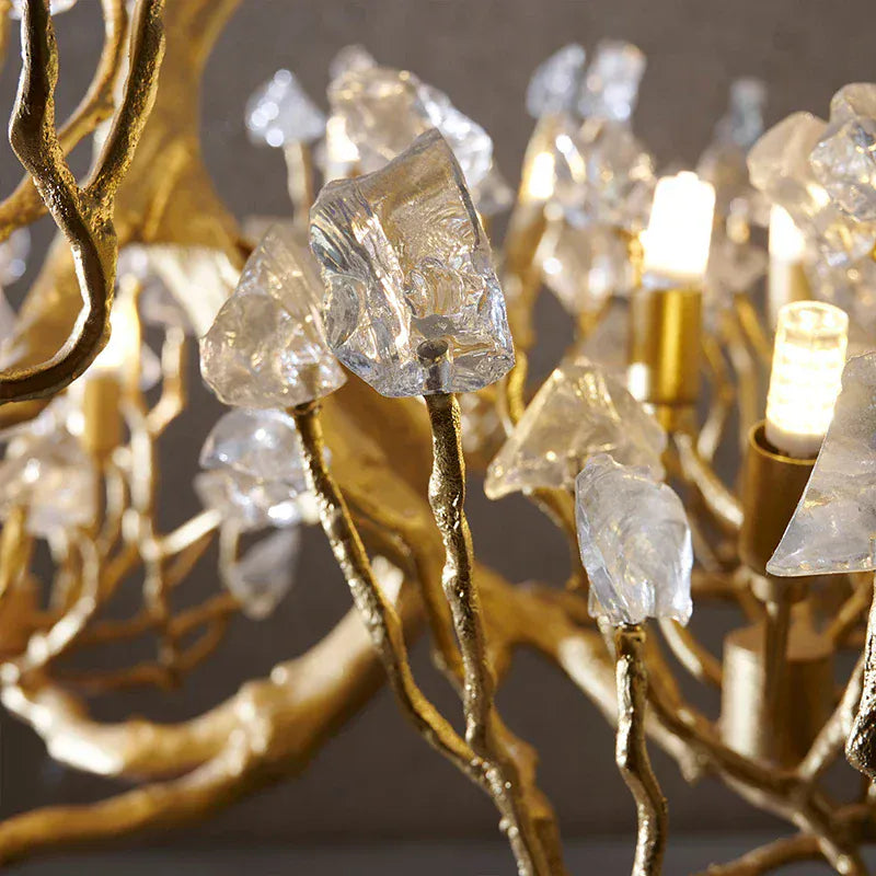 Tree branch pendant light with layered translucent leaf-style details and hanging chain