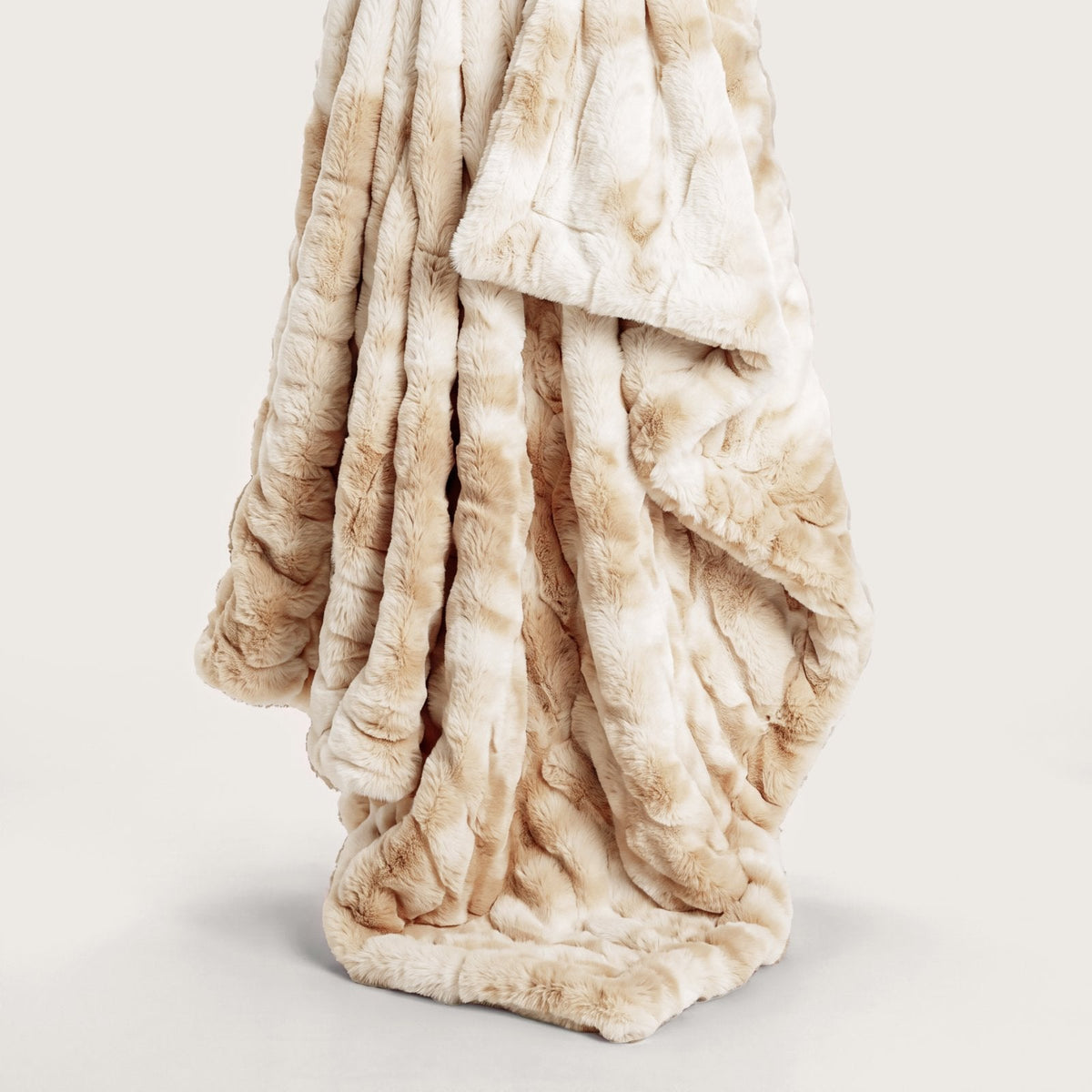 Plush beige throw blanket with tonal marble texture