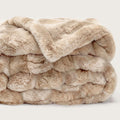 Plush beige throw blanket with tonal marble texture