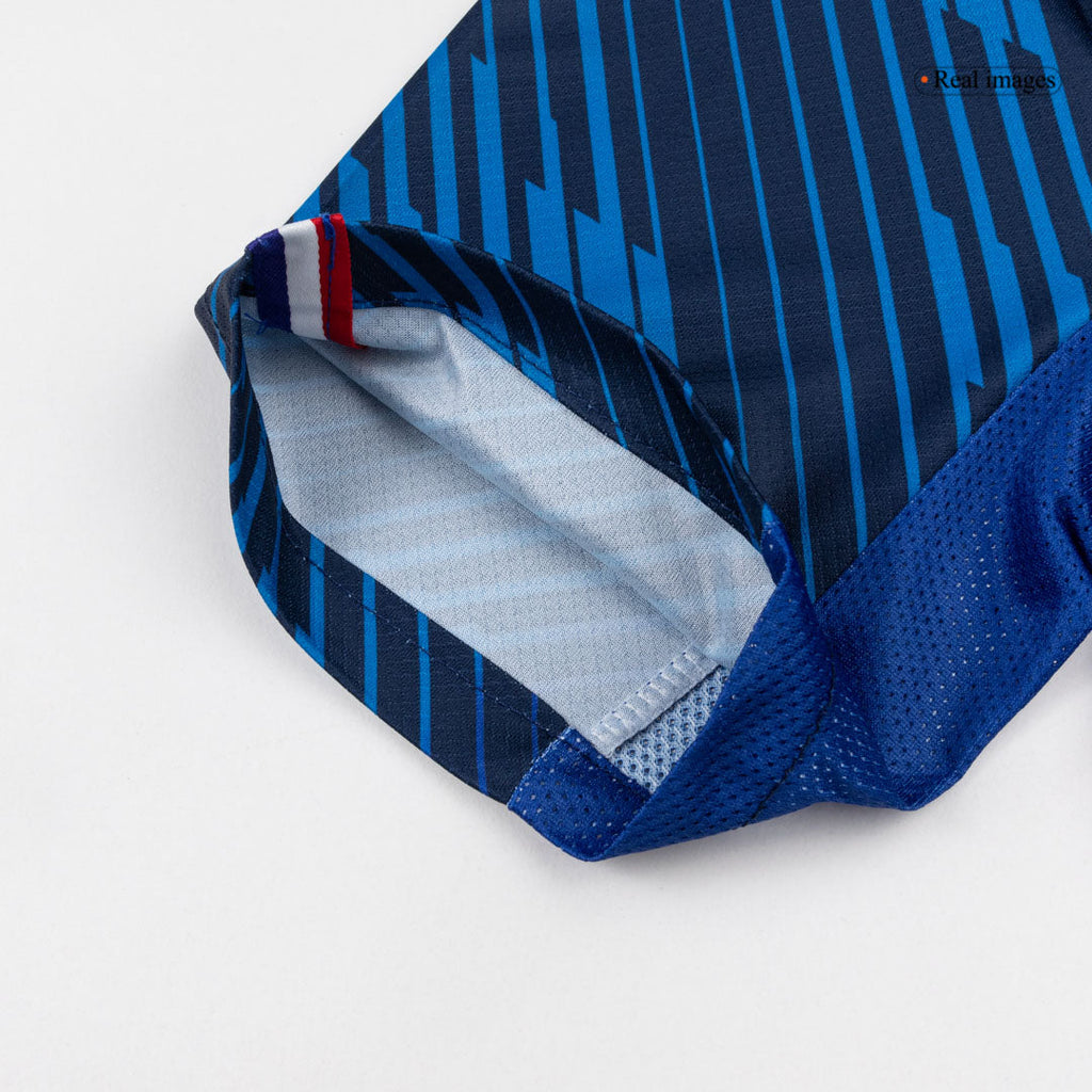 Blue short-sleeve football shirt with geometric pattern and white collar