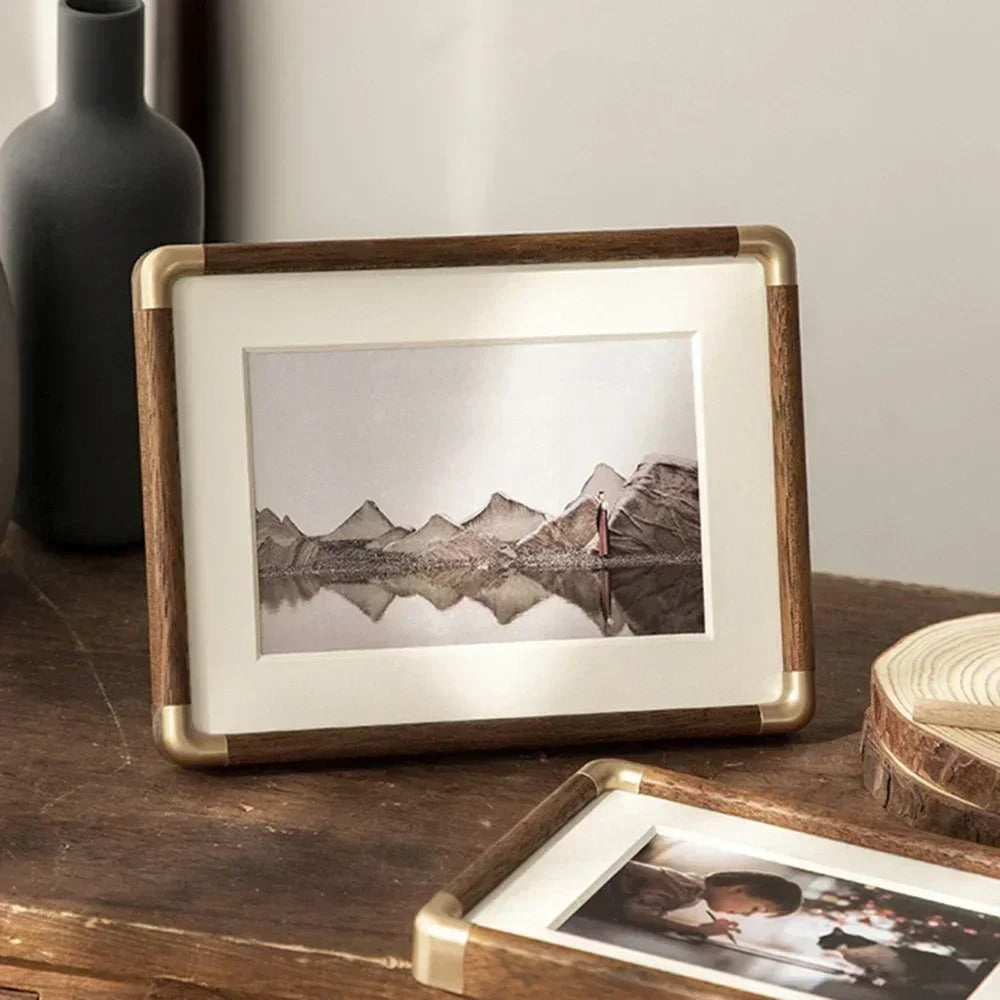 Tabletop photo frame with wood and brass-effect border