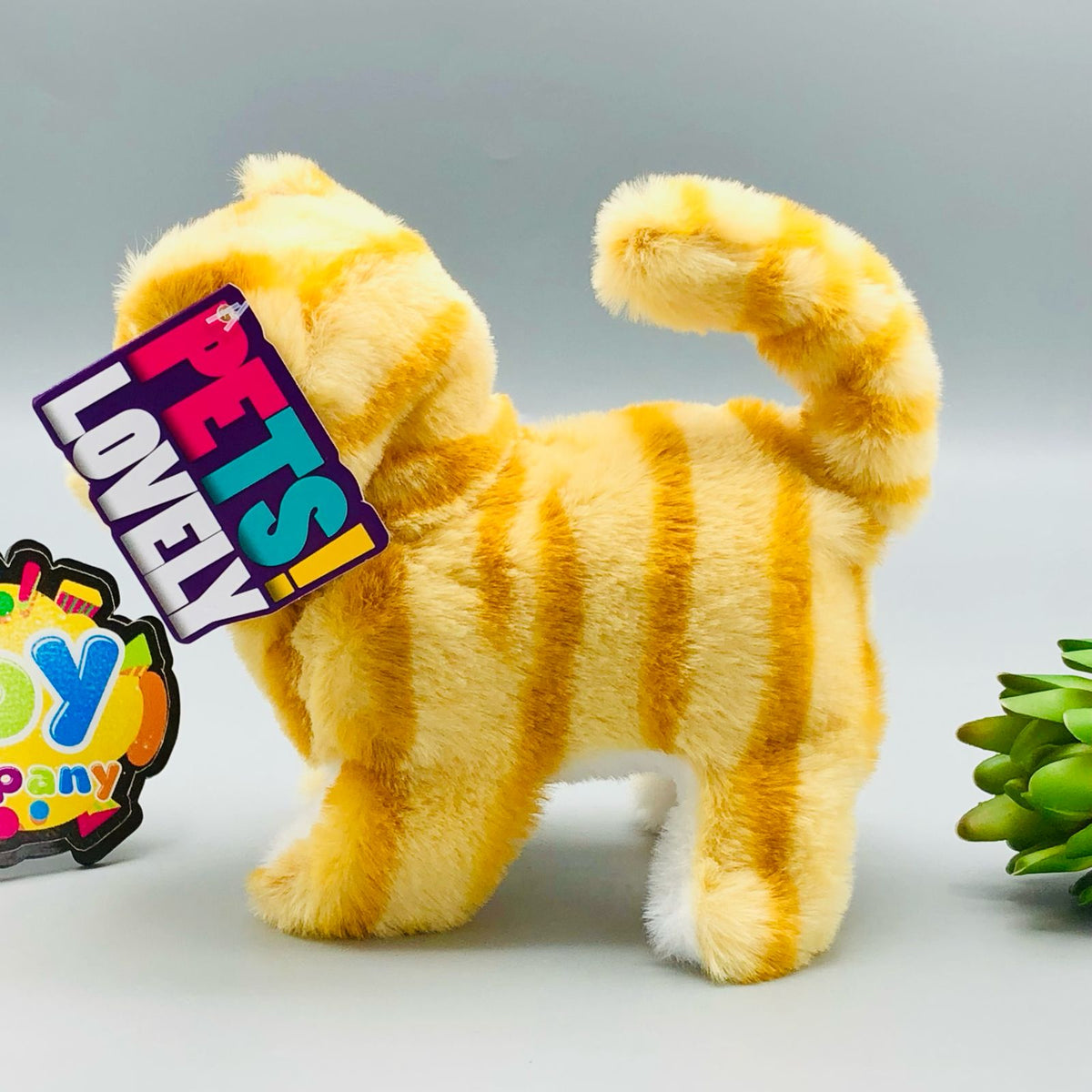 Walking plush cat toy with sound in white and orange colourways