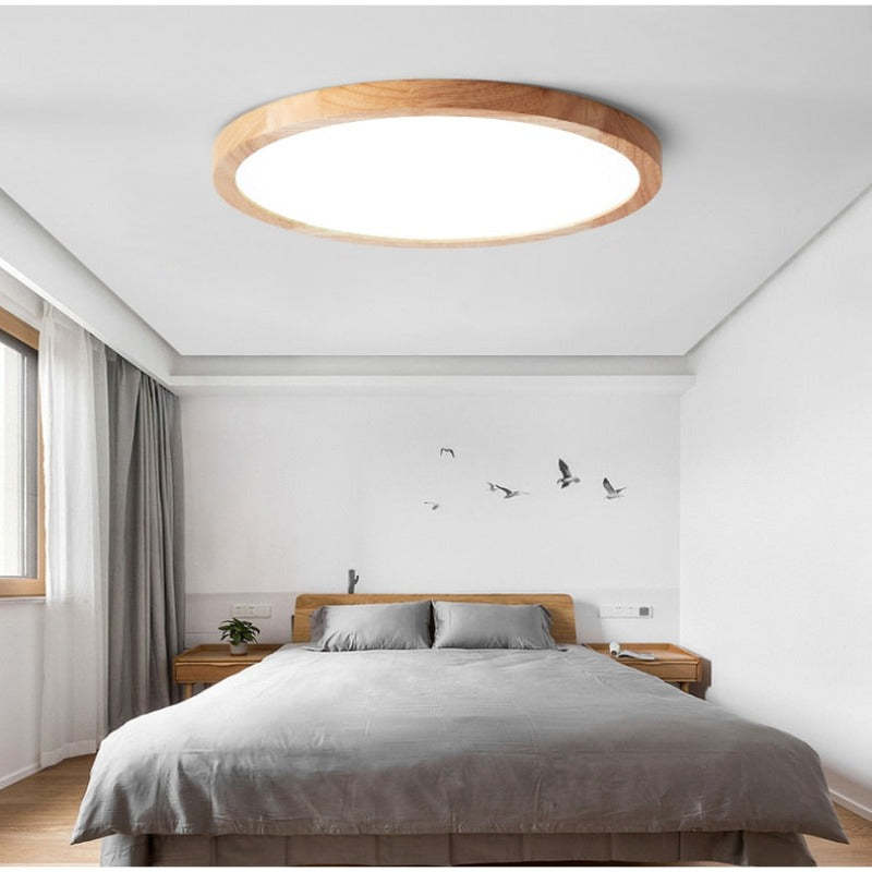 Round dimmable LED ceiling light with a light wood-effect surround