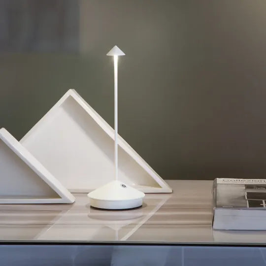 Wireless LED table lamp with a slim stem, conical shade and round base
