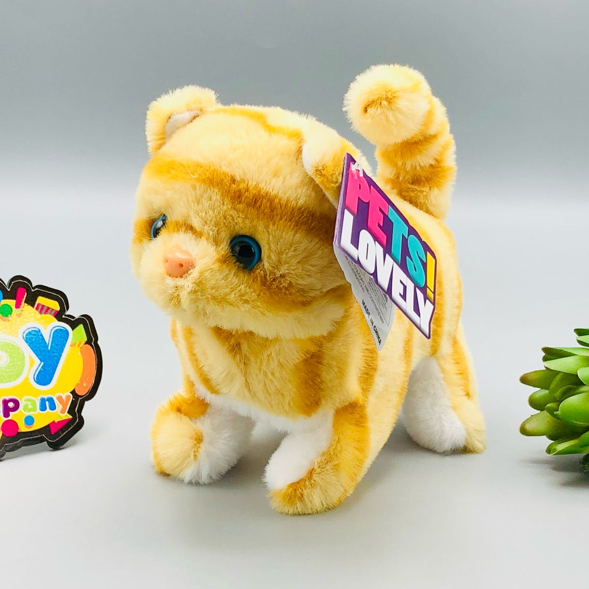 Walking plush cat toy with sound in white and orange colourways
